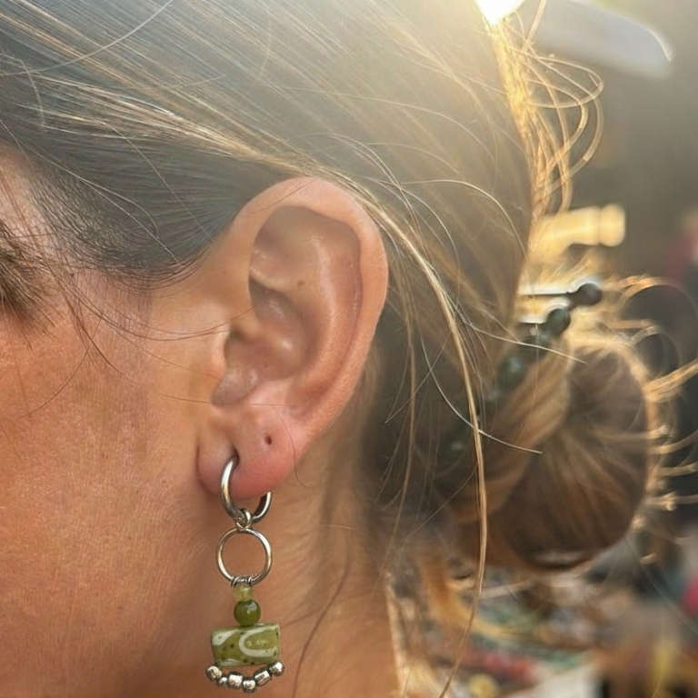 Close-up of a person wearing an earring 